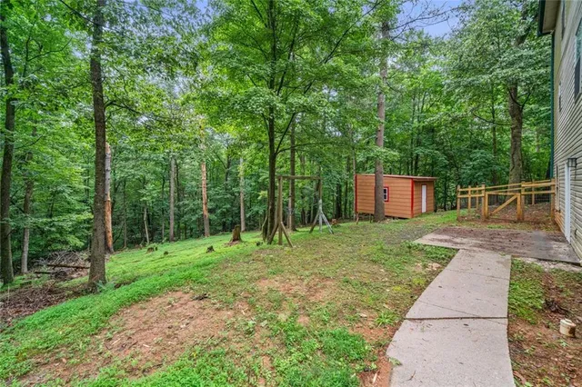 a backyard of a house with lots of green space