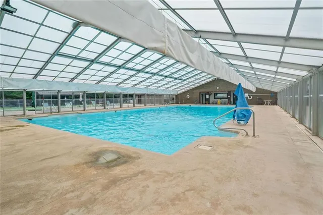 a swimming pool with a outdoor seating