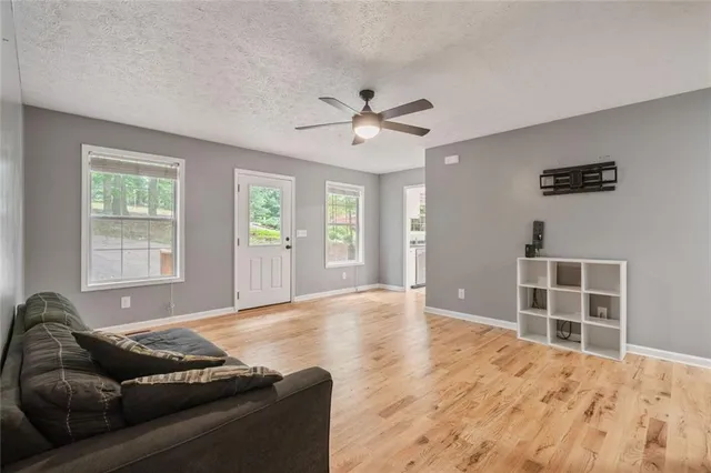 a living room with furniture and windows