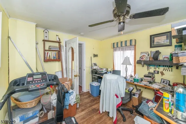 a living room with lots of furniture and a wooden floor