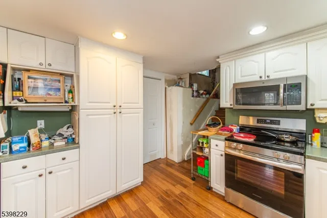 a kitchen with appliances and cabinets
