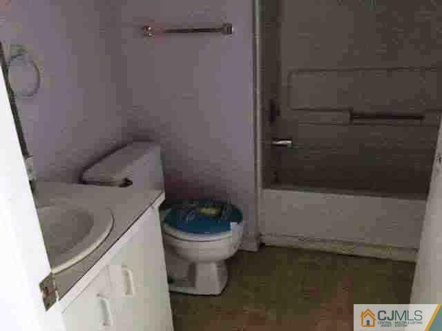710 Edpas Road, Unit 710 New Brunswick, NJ 08901 - Photo 5 of 6 a bathroom with a toilet and a sink