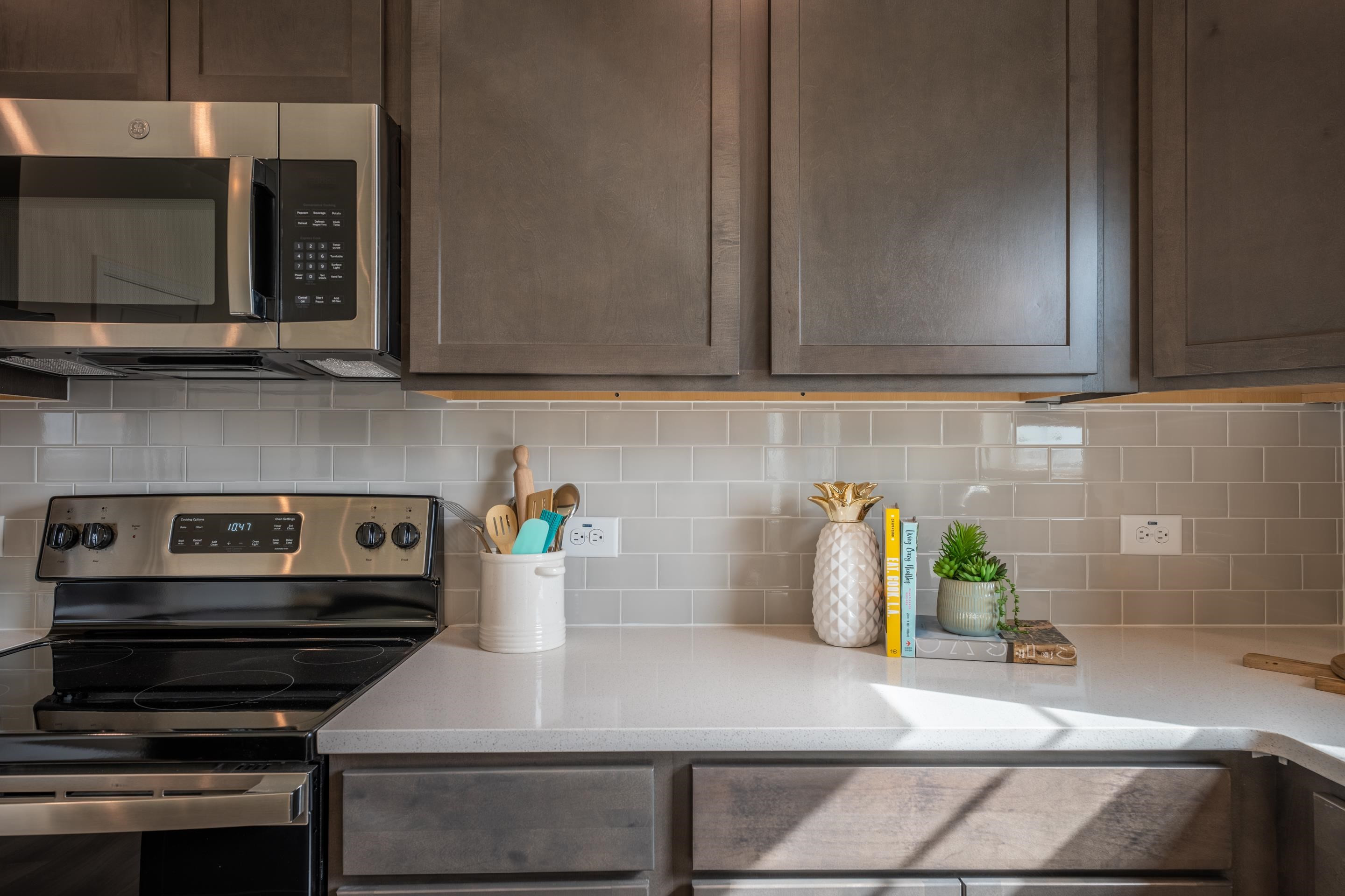 6517 Winter Spring Drive Wake Forest, NC 27587 - Photo 14 of 40 a kitchen with a stove and a microwave