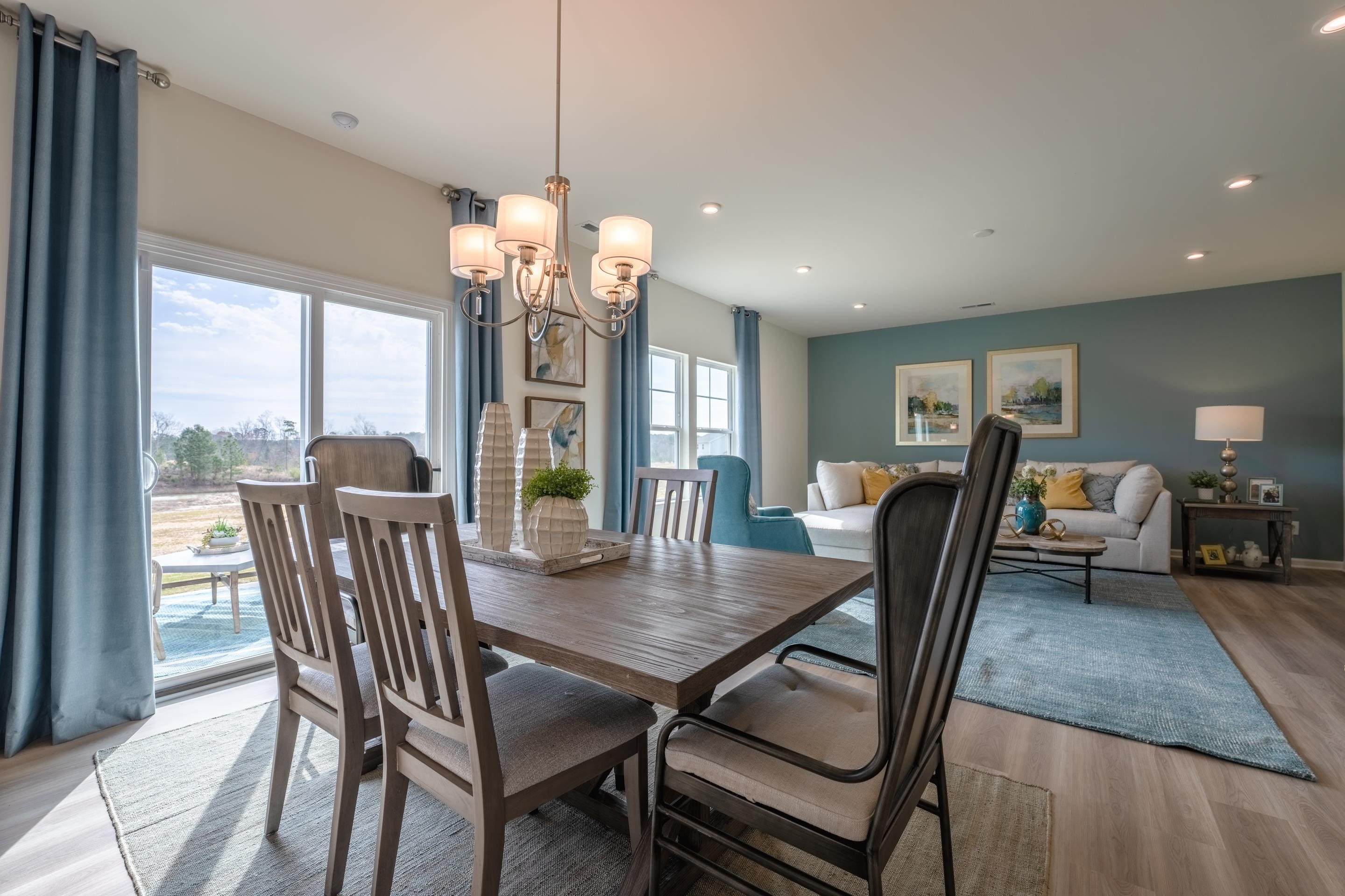 6517 Winter Spring Drive Wake Forest, NC 27587 - Photo 7 of 40 a view of a dining room with furniture window and outside view