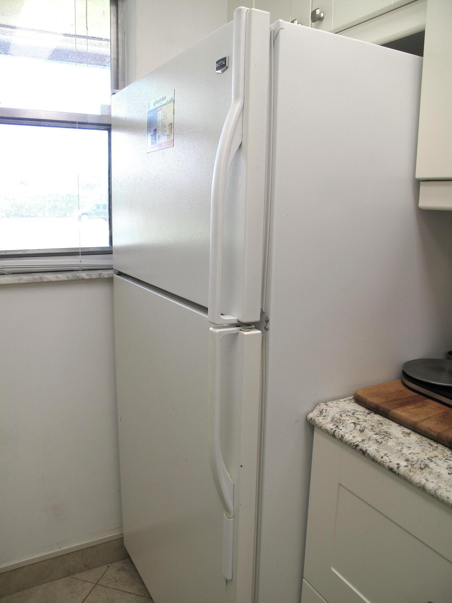 892 North High Point Boulevard North, Unit D Delray Beach, FL 33445 - Photo 13 of 44 a bathroom with a granite countertop shower and a sink