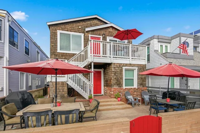 a patio with tables and chairs