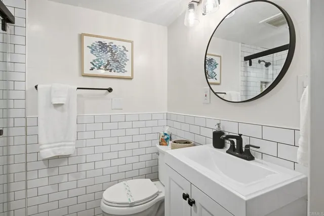 a bathroom with a toilet and sink
