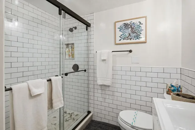 a bedroom with bed and a window