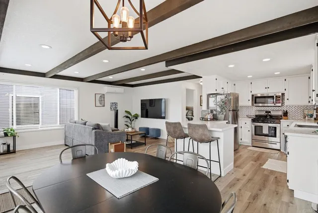 a view of kitchen with cabinets and wooden floor