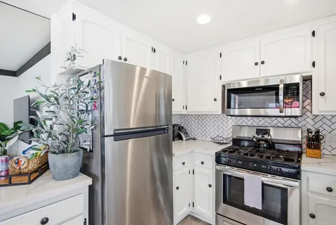 a view of a dining room with furniture and window