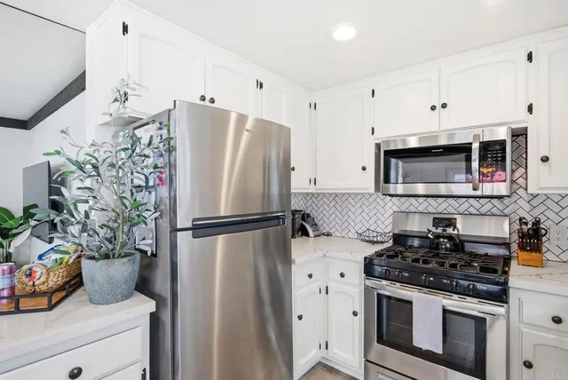 a view of a dining room with furniture and window