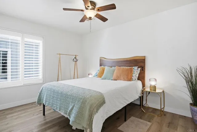 a view of a workspace with furniture and a gate