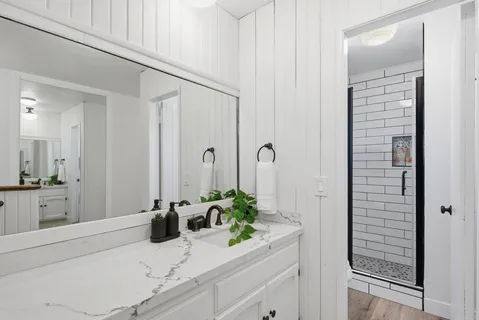 a bedroom with furniture and a window