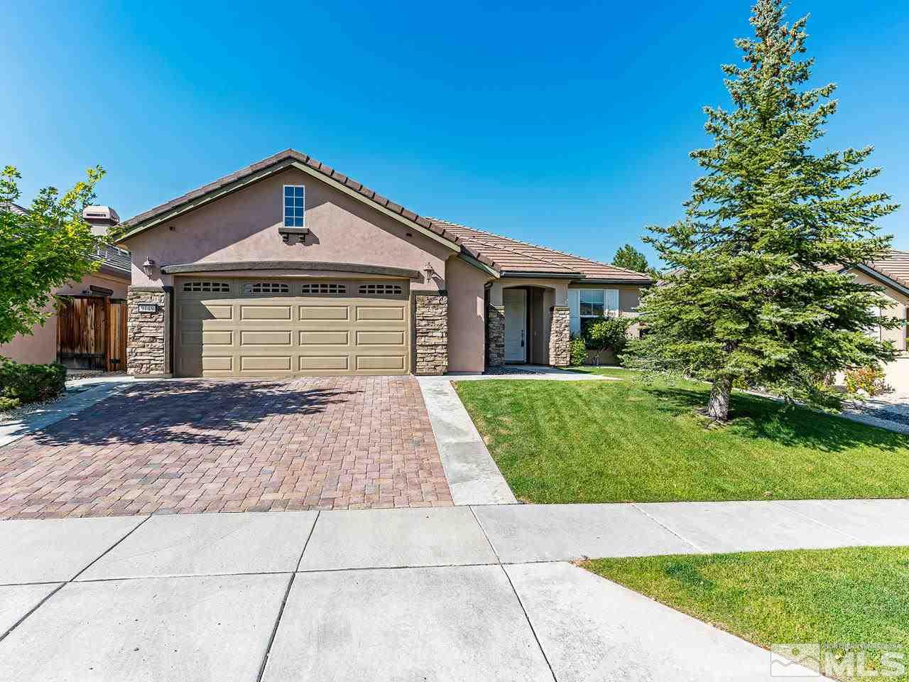 9149 Quilberry Way Reno, NV 89523 - Photo 1 of 20 a front view of a house with a garden