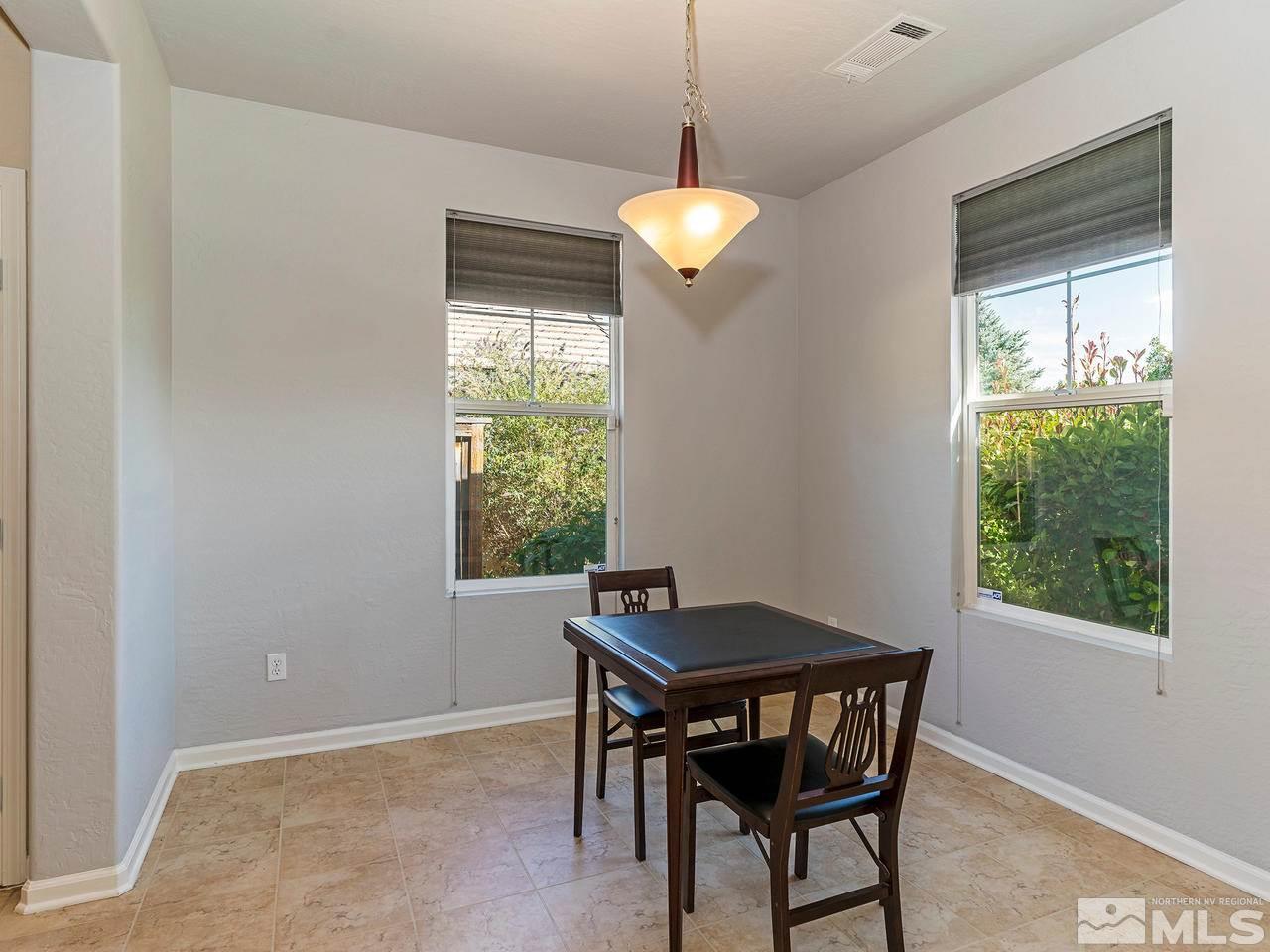 9149 Quilberry Way Reno, NV 89523 - Photo 13 of 20 a view of a dining room with a table and chairs