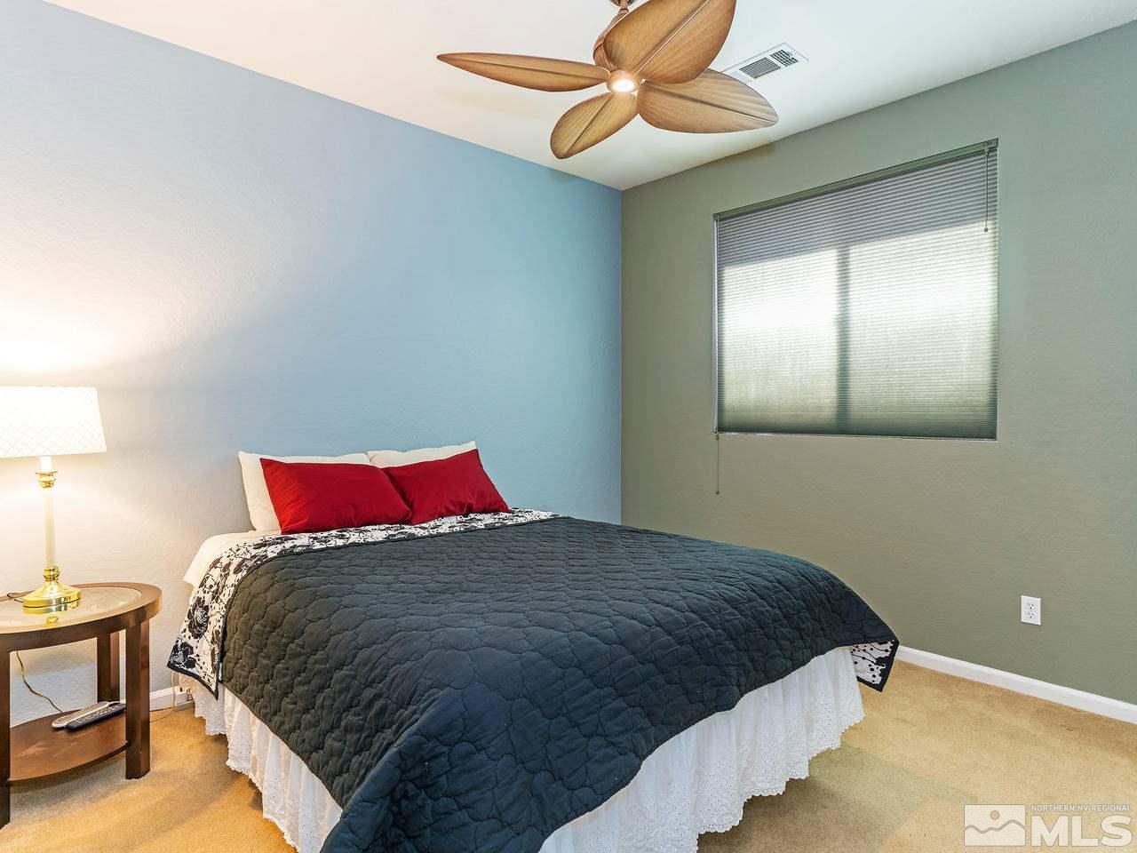 9149 Quilberry Way Reno, NV 89523 - Photo 18 of 20 a bedroom with a bed and window