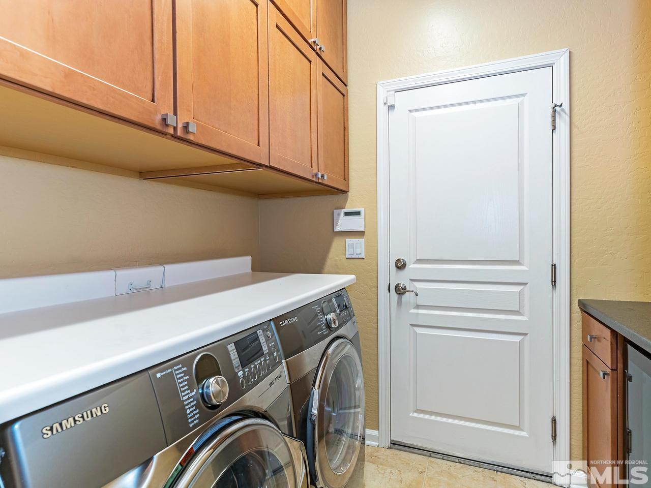 9149 Quilberry Way Reno, NV 89523 - Photo 19 of 20 a utility room with dryer and washer