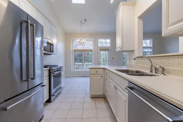 a kitchen with a sink stove and refrigerator