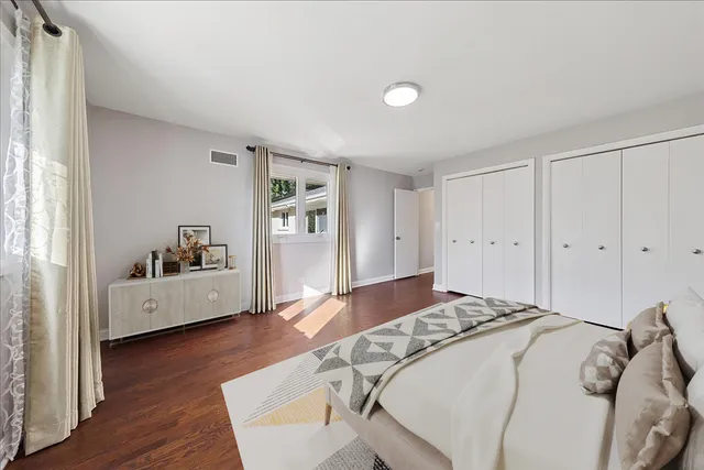 a living room with furniture rug and white walls