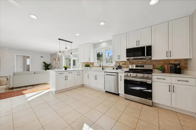 a living room with furniture or flat screen tv and a fireplace