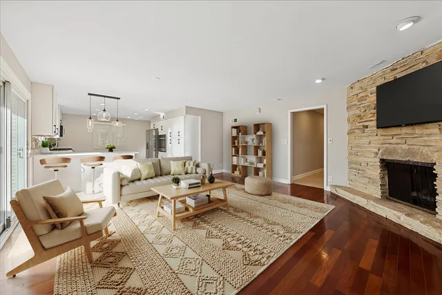 a living room with furniture fireplace and a flat screen tv