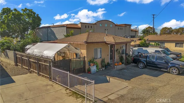 an aerial view of a house with yard and mountain view