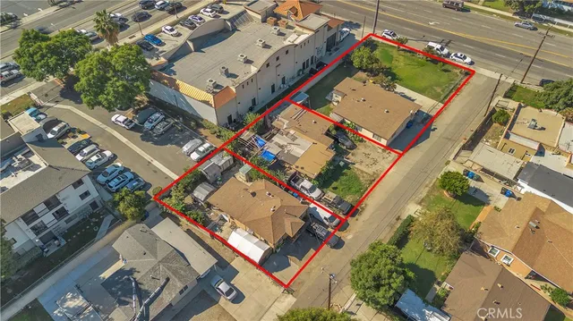 an aerial view of a houses with yard
