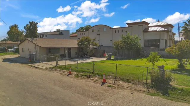 an aerial view of a house with yard and mountain view