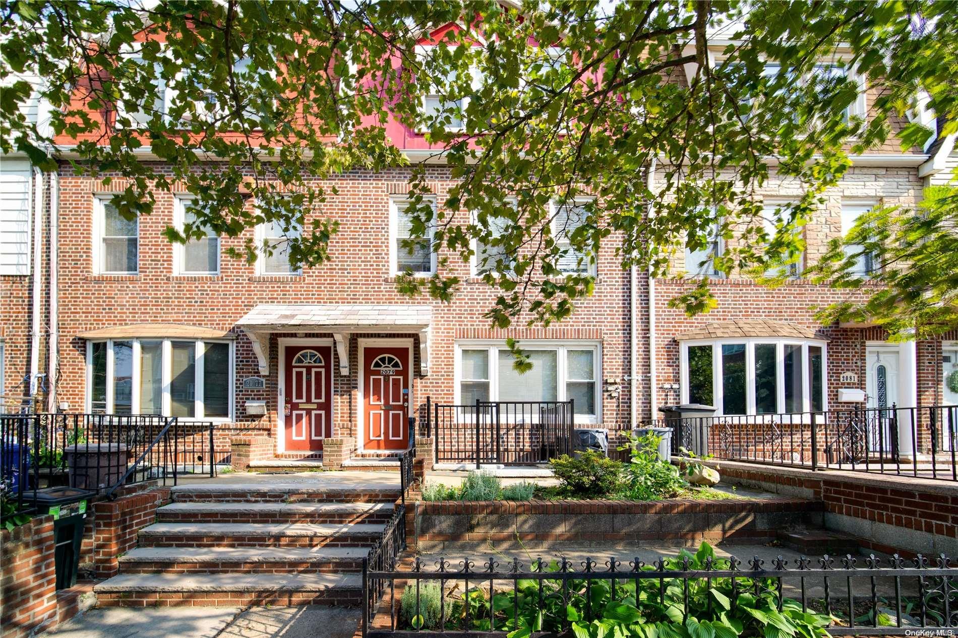 20-79 33rd Street Queens, NY 11105 - Photo 1 of 1 front view of a house with a small yard