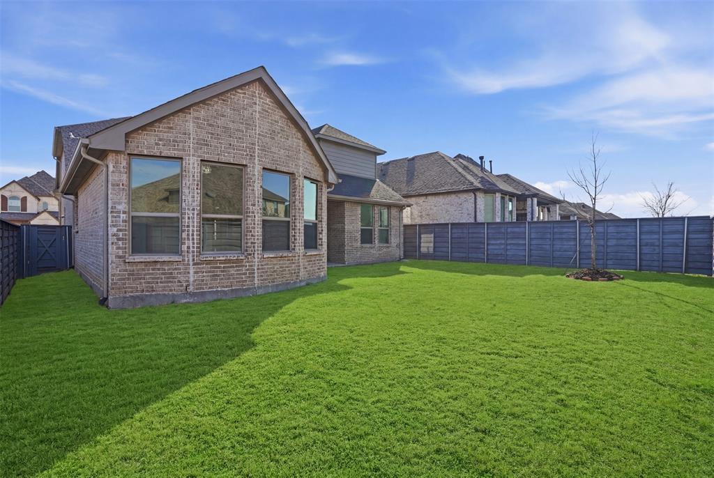 537 Oakmoss Street Little Elm, TX 76227 - Photo 25 of 39 a view of a house with a yard