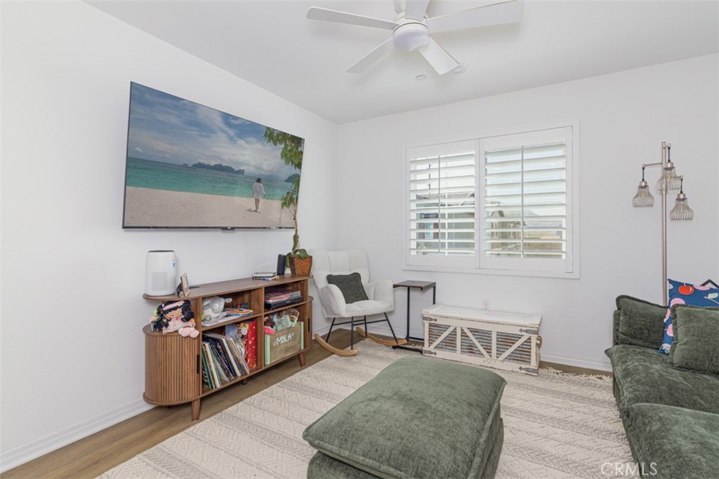 7395 Olive Grv Street Riverside, CA 92507 - Photo 7 of 18 Great room with ceiling fan and plantation shutters.