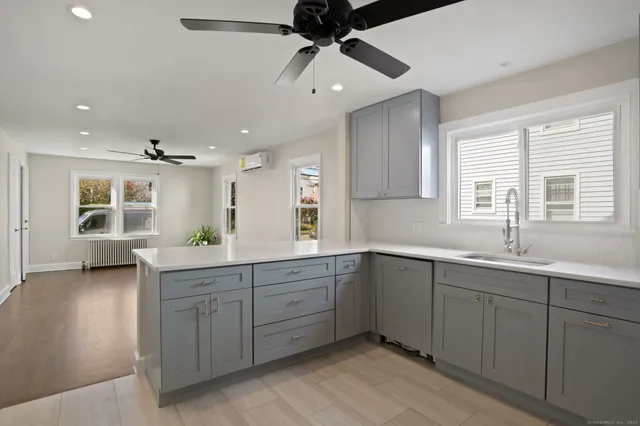 a spacious bathroom with a double vanity sink and a window