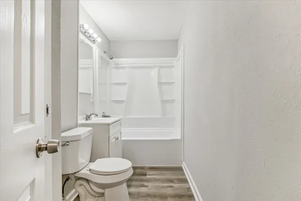 a bathroom with a toilet a sink and a bathtub