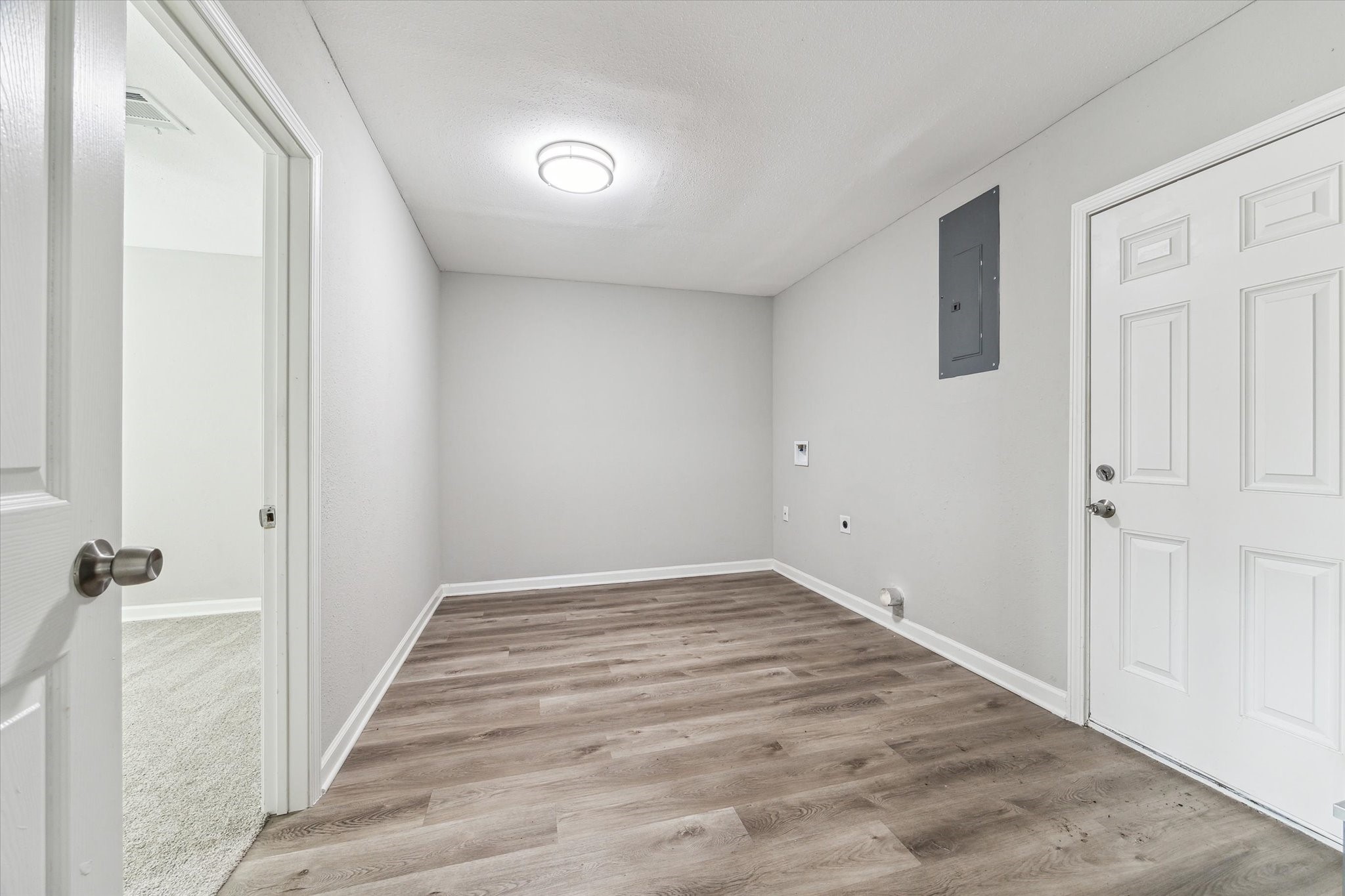 5130 Ripplebrook Drive Houston, TX 77045 - Photo 16 of 19 LARGE utility room with washer/dryer hookups and tons of space to use as extra storage/mudroom space. Door to right leads to the backyard.