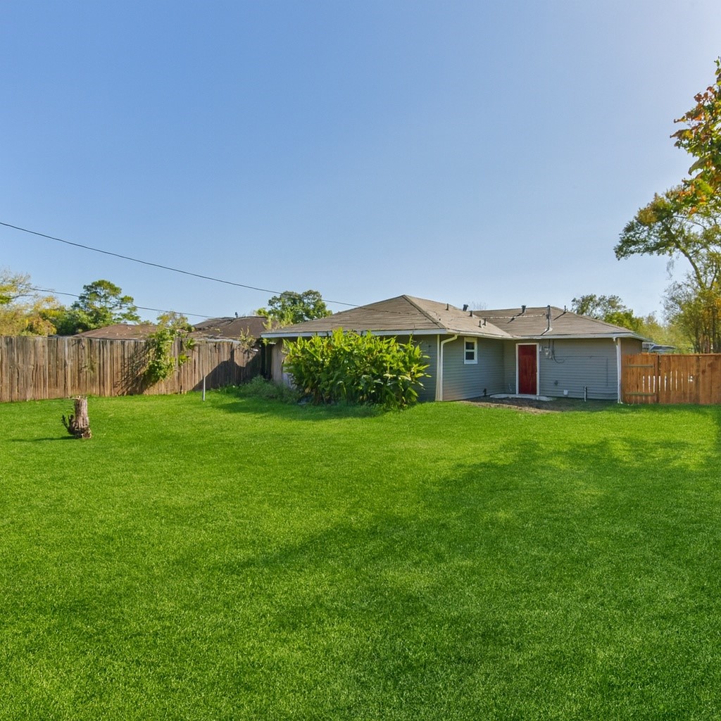 5130 Ripplebrook Drive Houston, TX 77045 - Photo 18 of 19 HUGE fenced-in backyard with plenty of room for kids and pets to play. Note: the grass was virtually edited.