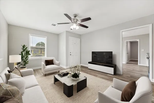 a living room with furniture and a flat screen tv