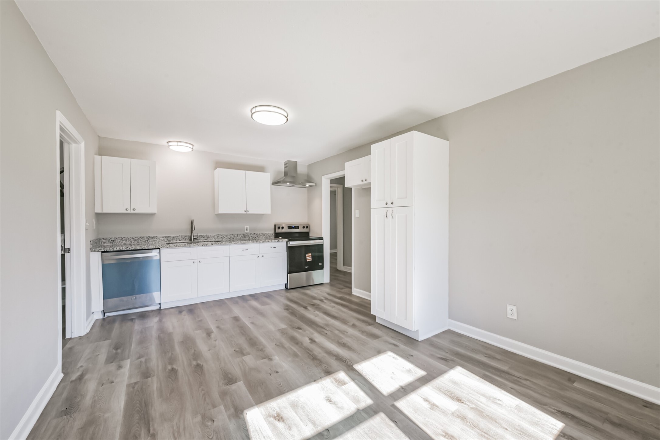 5130 Ripplebrook Drive Houston, TX 77045 - Photo 5 of 19 Updated KITCHEN with stainless steel appliances including a stainless steel dishwasher and electric range plus new exhaust vent. Granite countertops. Tons of storage! Large dining space opens to the kitchen.