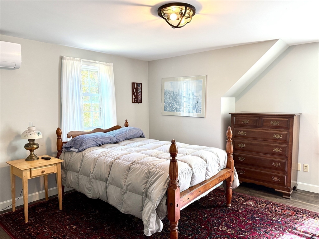 41 Hog Hollow Road Buckland, MA 01370 - Photo 21 of 42 a bedroom with a bed and a chandelier