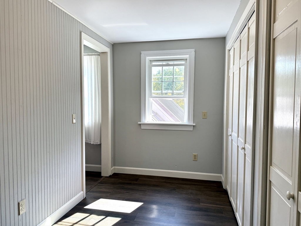 41 Hog Hollow Road Buckland, MA 01370 - Photo 23 of 42 a view of an empty room with wooden floor and a window
