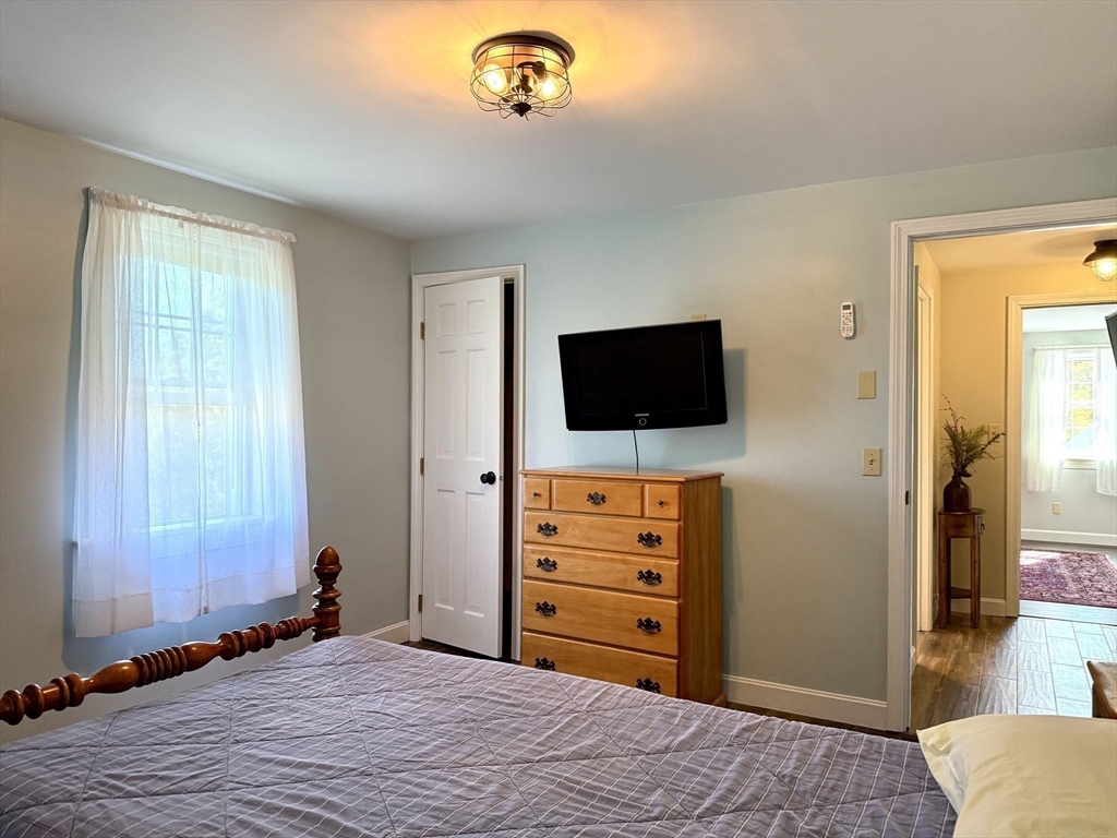 41 Hog Hollow Road Buckland, MA 01370 - Photo 28 of 42 a bedroom with a bed and a television