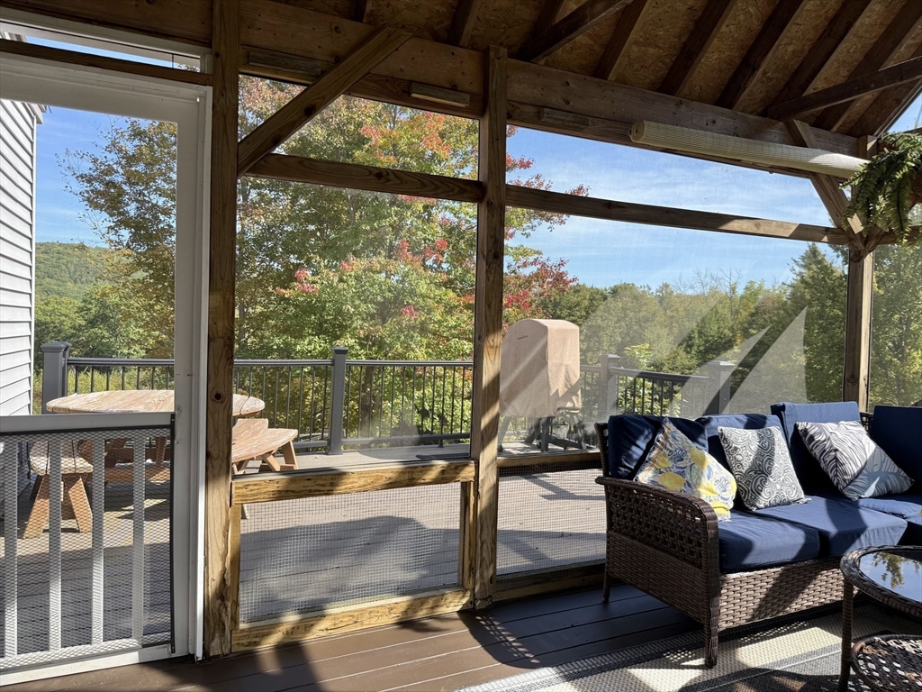 41 Hog Hollow Road Buckland, MA 01370 - Photo 32 of 42 a living room with large windows and furniture