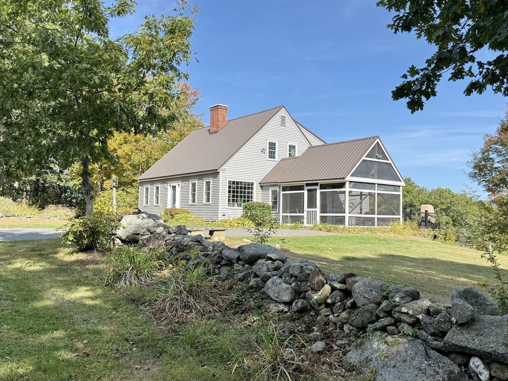 41 Hog Hollow Road Buckland, MA 01370 - Photo 35 of 42 a front view of a house with a garden