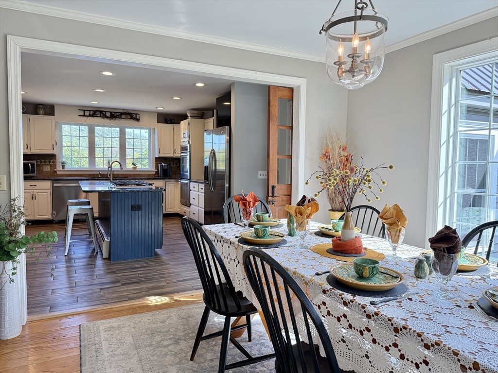 41 Hog Hollow Road Buckland, MA 01370 - Photo 7 of 42 a view of a dining room with furniture window and wooden floor