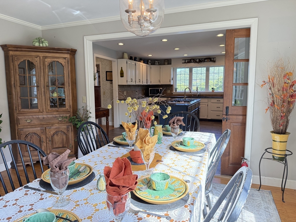 41 Hog Hollow Road Buckland, MA 01370 - Photo 8 of 42 a dining room with furniture a chandelier and a dining table