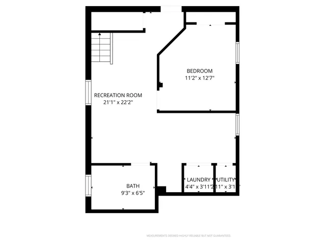 a picture of a bench in front of a wall