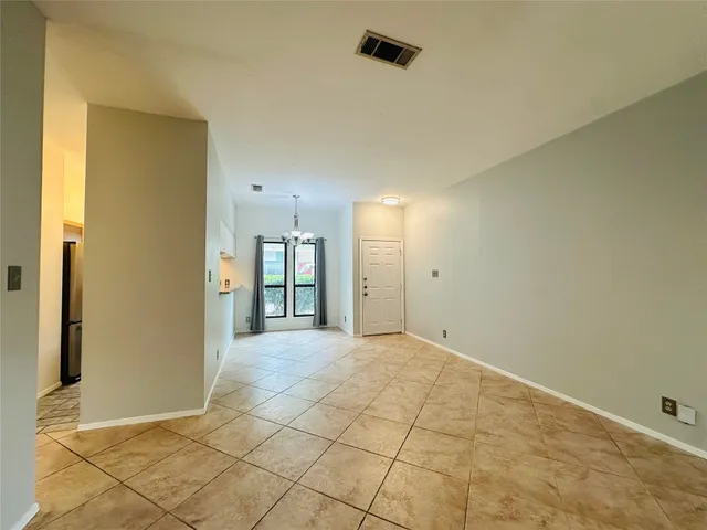 a white toilet sitting next to a bath tub