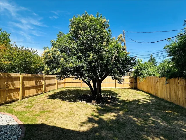 a view of swimming pool with a yard