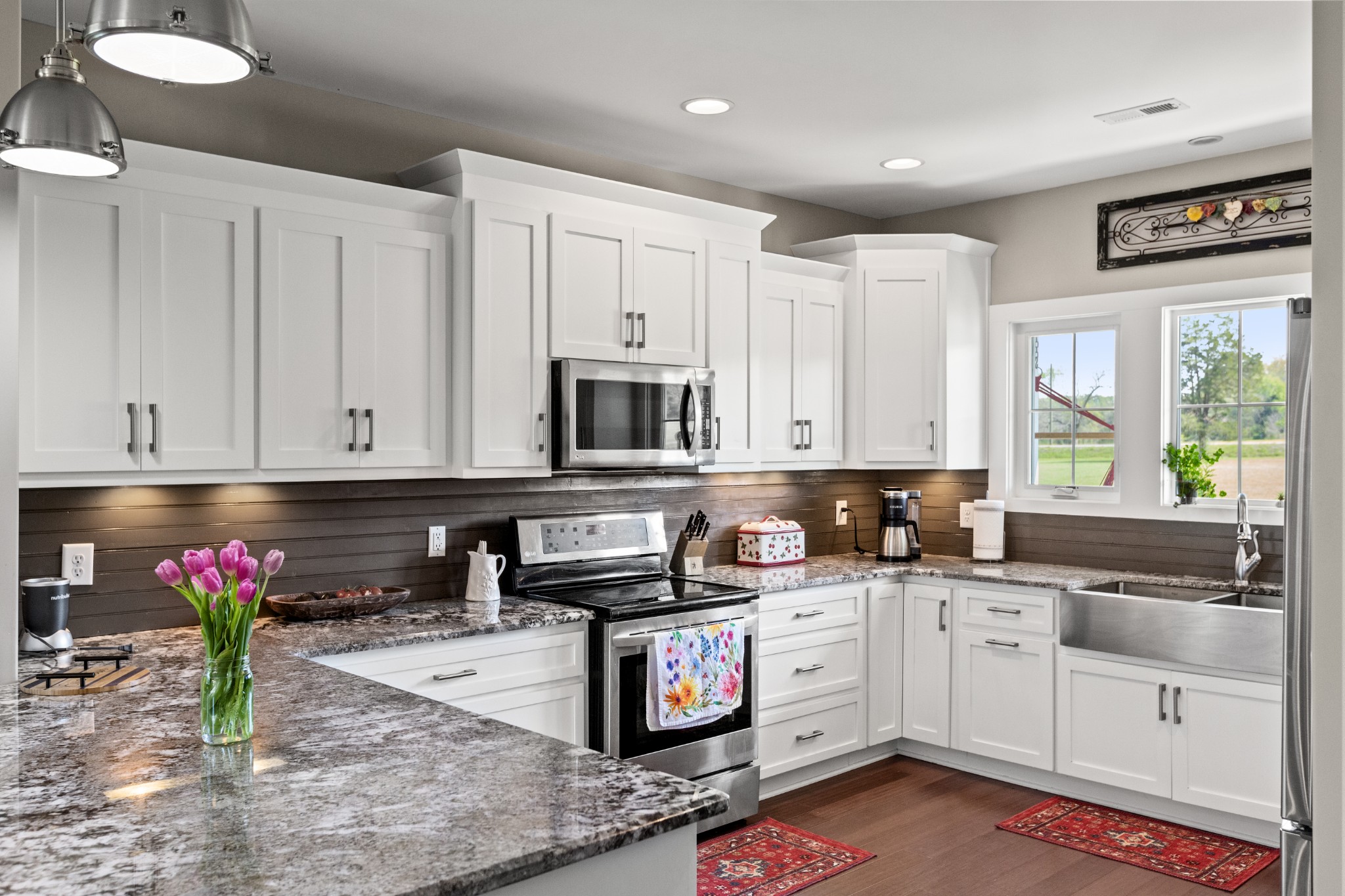 11484 Patterson Road Rockvale, TN 37153 - Photo 11 of 32 a kitchen with granite countertop a sink stove and cabinets