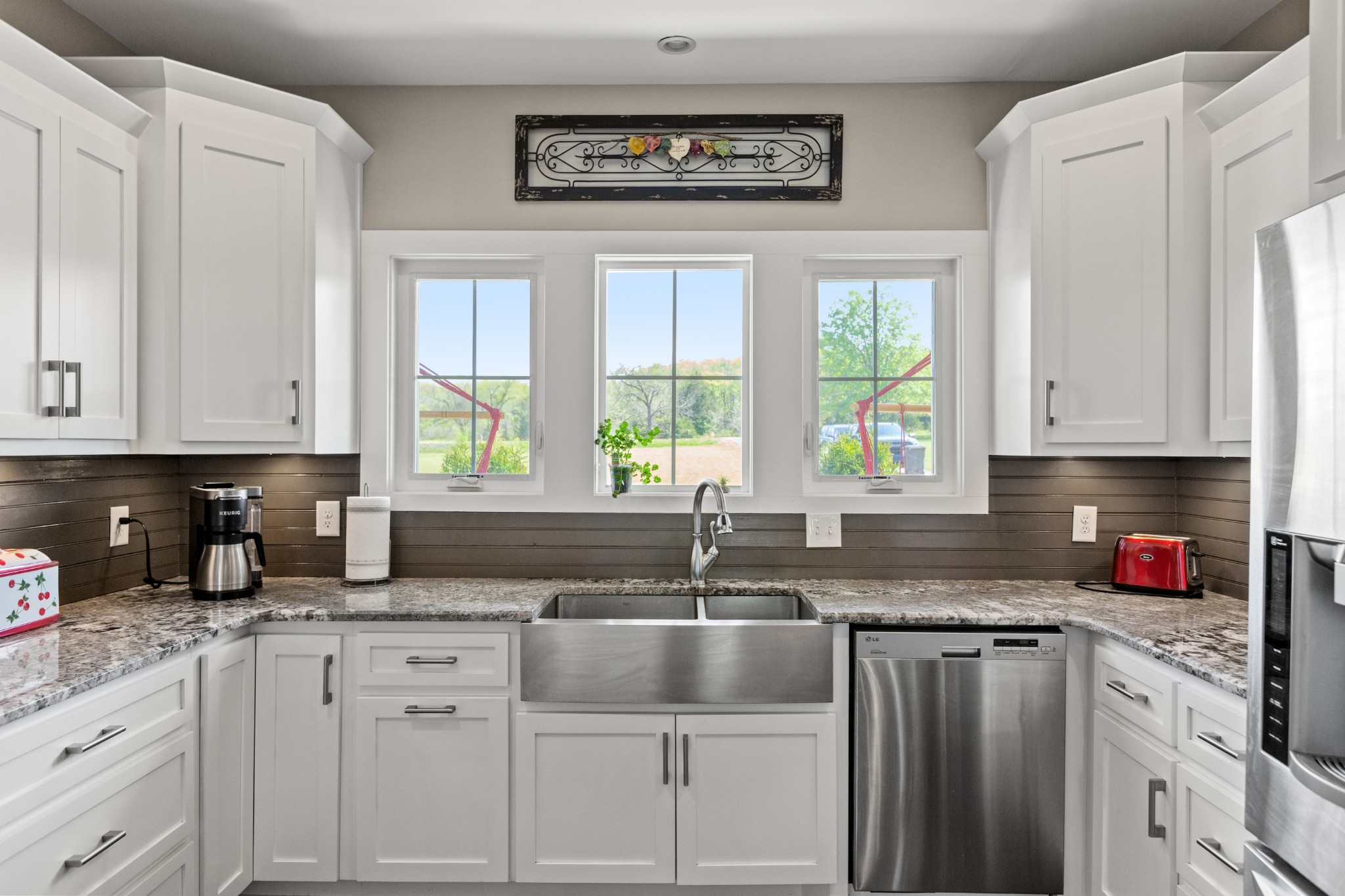 11484 Patterson Road Rockvale, TN 37153 - Photo 14 of 32 a kitchen with granite countertop a sink window and cabinets
