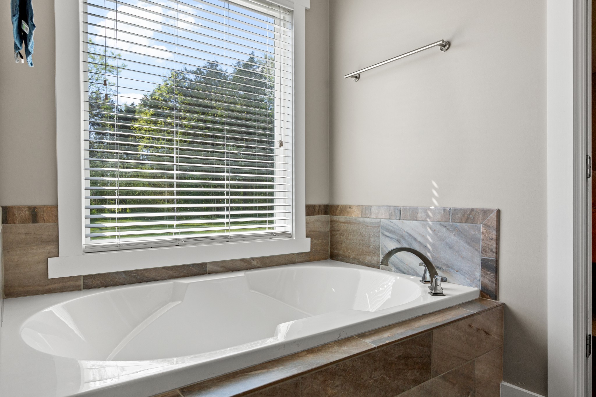 11484 Patterson Road Rockvale, TN 37153 - Photo 22 of 32 a bath tub sitting in a bathroom next to a window